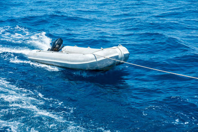 High angle view of boat sailing in sea