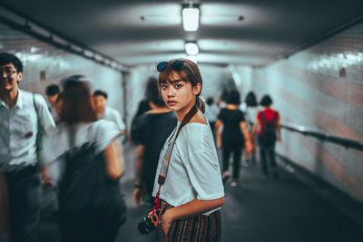 Women standing at subway station