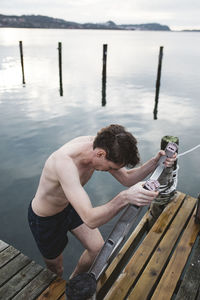 Man leaving lake