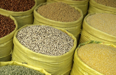 High angle view of legumes in sacks at market