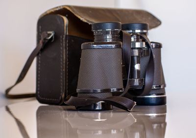 Close-up of camera on table