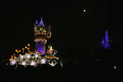 Illuminated buildings in city at night