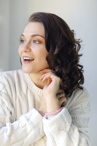 Young smiling woman looking away