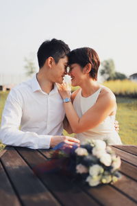 Young couple holding flowers