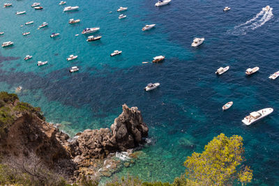 High angle view of rocks on sea shore