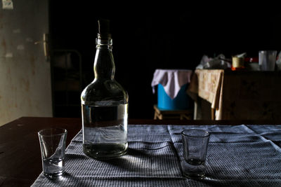 Close-up of wine bottles on table