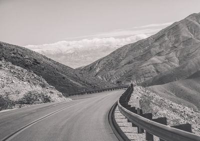 Scenic view of mountain road against sky