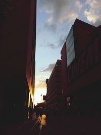 Buildings in city at sunset