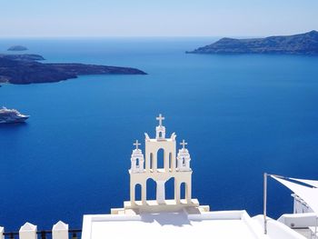 High angle view of church by blue sea at santorini