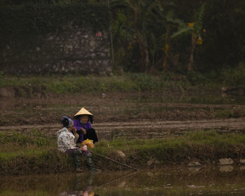 View of an elder farmer in vietnam rice factory