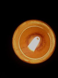 Close-up of coffee cup against black background