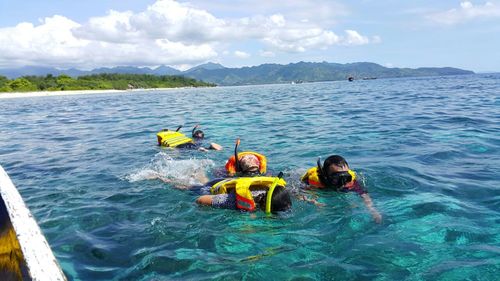 People enjoying in sea