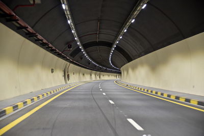 View of empty illuminated tunnel