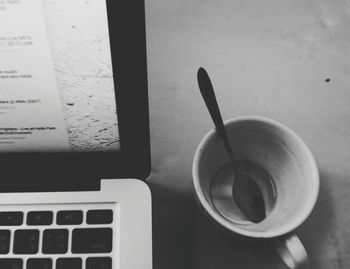 High angle view of coffee cup on table