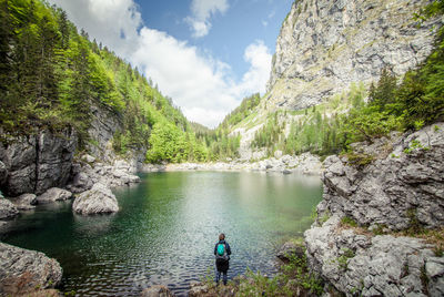 Rear view of woman looking at lake