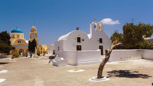 View of white building against blue sky