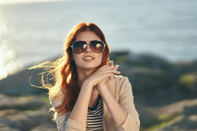 Portrait of young woman wearing sunglasses