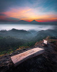 Scenic view of land against sky during sunset