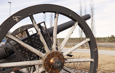 Close-up of old wheel on field