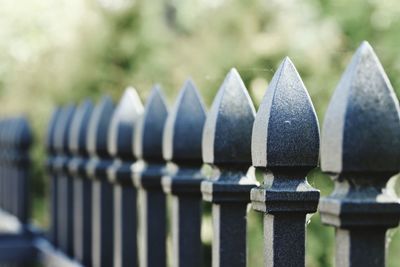 Close-up of metal fence against blurred background