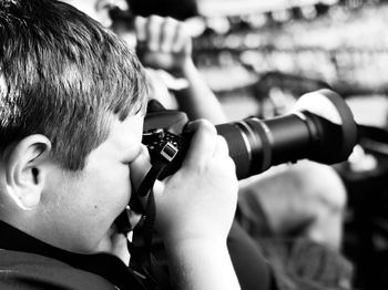 Portrait of boy photographing