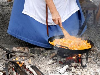 Low section of man preparing food