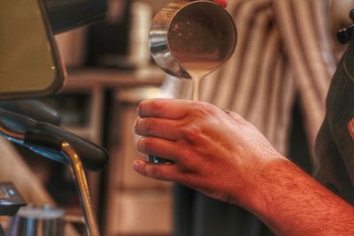 Close-up of man holding wineglass