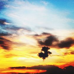 Scenic view of dramatic sky at sunset