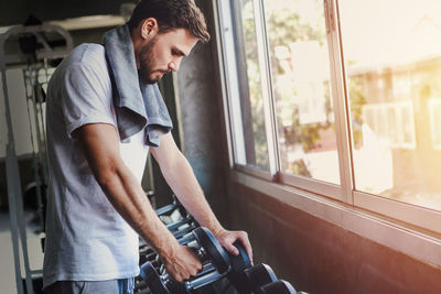 Man looking through train window