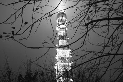 Low angle view of illuminated tower against sky