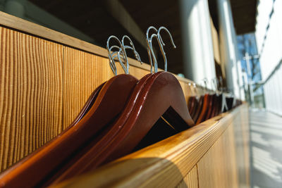 Close-up of clothes hanging on metal railing