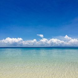 Scenic view of sea against blue sky