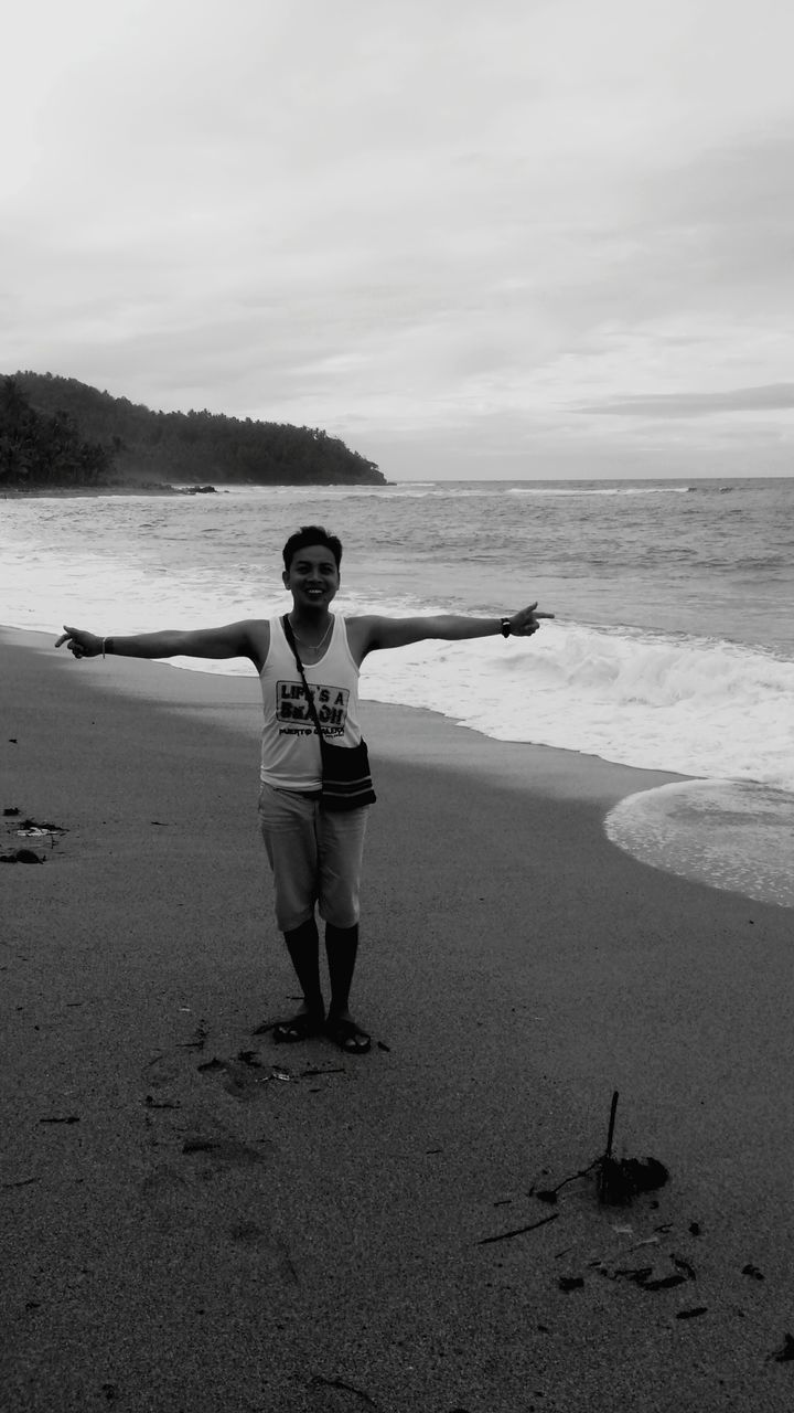 beach, sea, shore, full length, sand, sky, water, horizon over water, lifestyles, rear view, leisure activity, casual clothing, standing, tranquility, tranquil scene, scenics, beauty in nature, nature