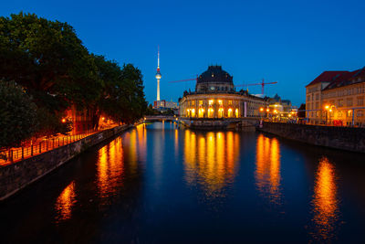 Illuminated buildings at waterfront