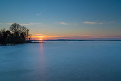 Scenic view of sea against sky during winter