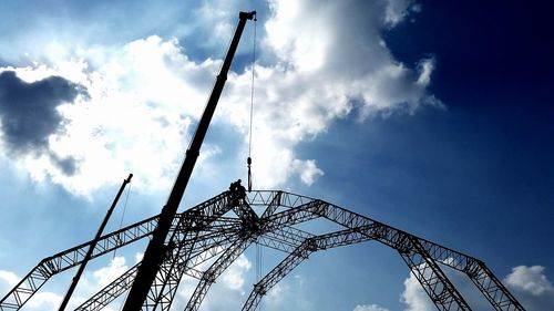 Low angle view of amusement park against sky