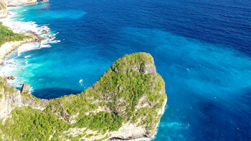 High angle view of rocks on sea