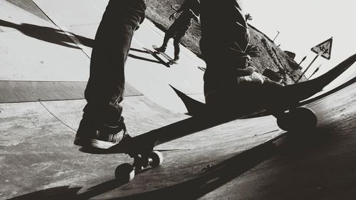 Low section of men skateboarding