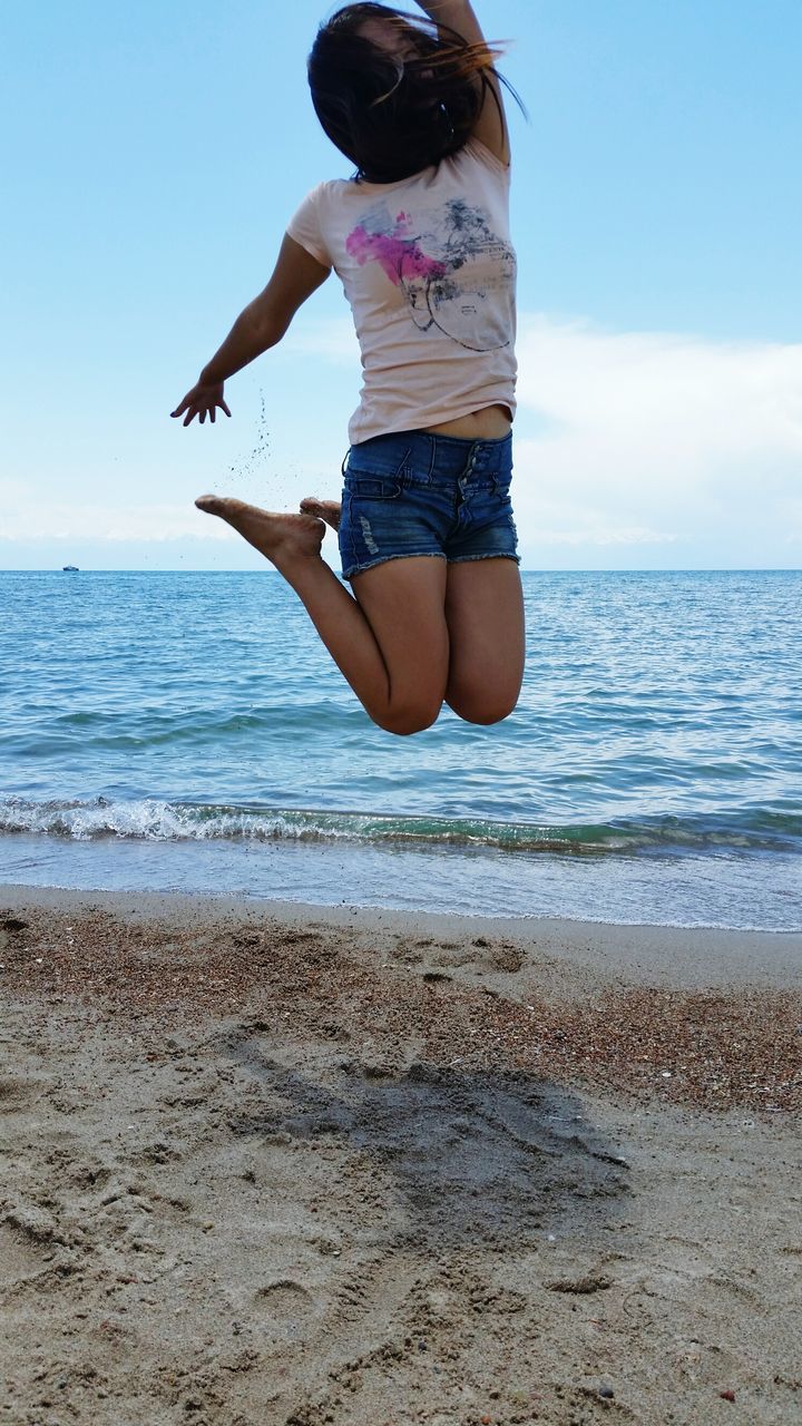 beach, sea, horizon over water, sand, shore, water, sky, full length, lifestyles, leisure activity, vacations, tranquil scene, standing, tranquility, nature, scenics, rear view, beauty in nature