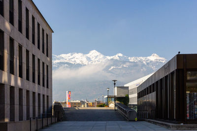 Street amidst buildings against sky