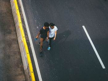 High angle view of men on road in city