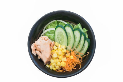 High angle view of food in bowl against white background