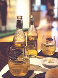 Close-up of wine bottles on table