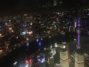 High angle view of illuminated cityscape at night