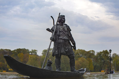 Low angle view of statue against sky