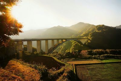 Bridge over river against sky