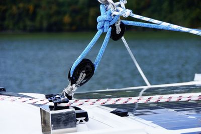 Close-up of rope tied on boat sailing in sea