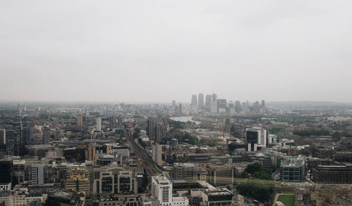 High angle view of buildings in city against sky