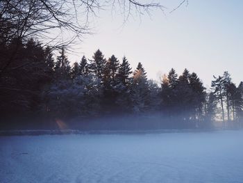 Scenic view of frozen landscape against clear sky