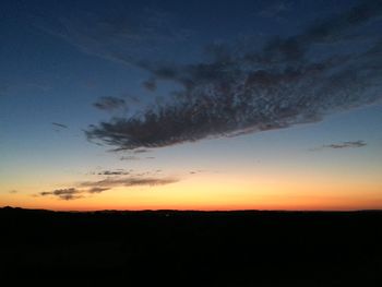 Scenic view of silhouette trees against sky at sunset